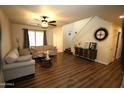 Bright living room featuring hardwood floors and a cozy seating area at 736 E Ivanhoe St, Chandler, AZ 85225