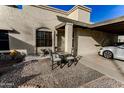 Charming patio with seating area, bird bath, and gravel landscaping at 7708 E Park View Dr Dr, Mesa, AZ 85208