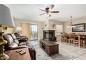 Open living and dining area with fireplace and tiled floors at 9183 W Century Dr, Arizona City, AZ 85123