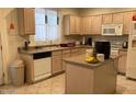 Spacious kitchen featuring an island and ample cabinetry at 9841 E Forge Ave, Mesa, AZ 85208