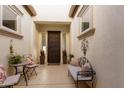 Inviting front entry with seating area and decorative accents at 1435 E Artemis Trl, Queen Creek, AZ 85140