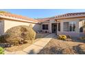 Front entry with walkway and drought-tolerant plants at 19751 N Desert Song Way, Surprise, AZ 85374