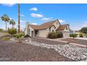 House exterior with a walkway, landscaping, and a palm tree at 290 S Hazelton Dr, Chandler, AZ 85226