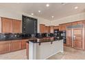 Island kitchen with granite countertops and ample cabinet space at 22318 N 36Th St, Phoenix, AZ 85050