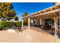 Covered patio with seating area and a fire pit, perfect for outdoor gatherings at 2714 N 63Rd St, Mesa, AZ 85215