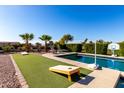 Relaxing poolside area with games and plenty of space for entertaining at 2714 N 63Rd St, Mesa, AZ 85215