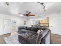 Open living room featuring hardwood floors, a ceiling fan, and open access to the kitchen at 2850 E Cortez St, Phoenix, AZ 85028