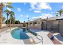 Backyard pool area with a diving board and seating area for outdoor relaxation and enjoyment at 2850 E Cortez St, Phoenix, AZ 85028