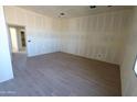 Bright bedroom with tiled floors and a neutral color palette ready for customization at 28551 N 257Th Ave, Wittmann, AZ 85361