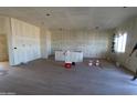 Spacious living room featuring light wood floors and neutral walls ready for personalization at 28551 N 257Th Ave, Wittmann, AZ 85361