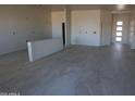 Bright, spacious living space with modern tile flooring and recessed lighting installation in progress at 28583 N 257Th Dr, Wittmann, AZ 85361