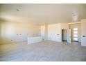 Bright and open living room featuring modern tile flooring and neutral wall paint at 28583 N 257Th Dr, Wittmann, AZ 85361