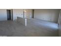 Open-concept living space featuring stylish tile floors and convenient electrical outlets along the walls at 28583 N 257Th Dr, Wittmann, AZ 85361
