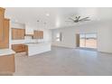 Open concept kitchen with shaker cabinets, large island, and stainless steel appliances at 28615 N 257Th Dr, Wittmann, AZ 85361