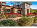 A red flowering bush lines the exterior of the house at 3461 N Ladera Cir, Mesa, AZ 85207