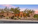 House exterior view, showcasing stone and desert landscaping at 3461 N Ladera Cir, Mesa, AZ 85207