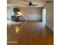 Spacious living room with hardwood floors and kitchen views at 3506 W Yucca St, Phoenix, AZ 85029