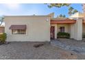 Tan stucco condo with red tile roof, walkway, and small front yard at 3535 W Monte Cristo Ave # 101, Phoenix, AZ 85053