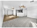 Open living space featuring hardwood and carpeted floors at 40551 N Jodi Dr, San Tan Valley, AZ 85140