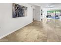 Spacious living area with tile floors and large artwork at 4950 N Miller Rd # 130, Scottsdale, AZ 85251