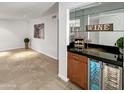 Wet bar with wine refrigerator, great for entertaining at 4950 N Miller Rd # 130, Scottsdale, AZ 85251