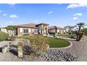 Beautiful front yard with well-maintained landscaping, decorative rocks, and artificial grass at 5345 E Mclellan Rd # 89, Mesa, AZ 85205