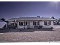 Cute ranch home with front yard landscaping and rock at 5933 W Redfield Rd, Glendale, AZ 85306