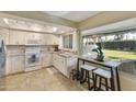 Modern kitchen featuring white cabinets, granite countertops, and stainless steel appliances at 633 S 77Th St, Mesa, AZ 85208
