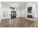 Spacious living room with fireplace and hardwood floors at 10102 E Saddle Horn Trl, Scottsdale, AZ 85255