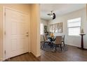 Small dining area with a round table and four gray chairs at 105 S 224Th Ave, Buckeye, AZ 85326