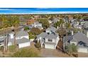 Aerial view of the neighborhood with well-maintained homes and mature trees, including palm trees at 1179 N Granada Dr, Chandler, AZ 85226