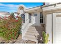 Front entrance with landscaped yard, steps leading up to the front door, and large bougainvillea at 1179 N Granada Dr, Chandler, AZ 85226