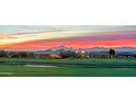 Stunning aerial view of homes on a golf course with mountain backdrop at 11890 N 118Th St, Scottsdale, AZ 85259