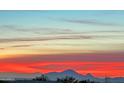 Beautiful sunset over mountain range, seen from a home at 11890 N 118Th St, Scottsdale, AZ 85259