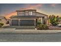 Two-story house with a three-car garage and desert landscaping at 15791 W Mohave St, Goodyear, AZ 85338