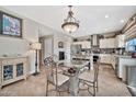 Spacious kitchen with stainless steel appliances and an island at 15791 W Mohave St, Goodyear, AZ 85338