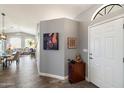 Welcoming entryway with tiled flooring, a front door, and decor, leading into an open living space at 17318 E Quail Ridge Dr, Fountain Hills, AZ 85268