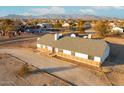 Aerial view showcasing a house with a large lot and mountain backdrop at 22352 W Meade Ln, Buckeye, AZ 85326