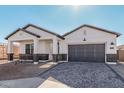 New construction home with a welcoming front porch and attractive landscaping at 2553 E Virginia Cir, Mesa, AZ 85213