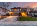 Two-story house with brown garage door, landscaping, and a spacious front yard at 29405 W Columbus Ave, Buckeye, AZ 85396