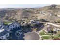 Aerial view of a home with desert landscaping, a pool, and mountain views at 3439 E Tonto Dr, Phoenix, AZ 85044