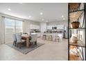 Modern kitchen with island, stainless steel appliances, and eat-in area at 39995 W Agave Rd, Maricopa, AZ 85138