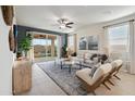 Spacious living room with sliding doors leading to the backyard at 39995 W Agave Rd, Maricopa, AZ 85138