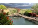 Relaxing pool area with lush landscaping and scenic views of the golf course at 42225 N Celebration Way, Phoenix, AZ 85086