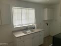 Small kitchen with white cabinets and a double sink at 510 W 14Th St, Tempe, AZ 85281