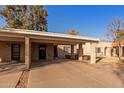 Tan colored exterior with carport and small front yard at 518 E Colgate Dr, Tempe, AZ 85283