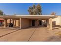 Tan colored exterior with carport and small front yard at 518 E Colgate Dr, Tempe, AZ 85283