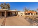 Exterior view showing multiple units with carports at 518 E Colgate Dr, Tempe, AZ 85283