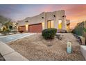 Two-car garage, and desert landscaping at 6067 E Knolls S Way, Cave Creek, AZ 85331