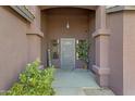 Inviting front entry with a metal door and welcome sign at 7029 S 16Th Way, Phoenix, AZ 85042